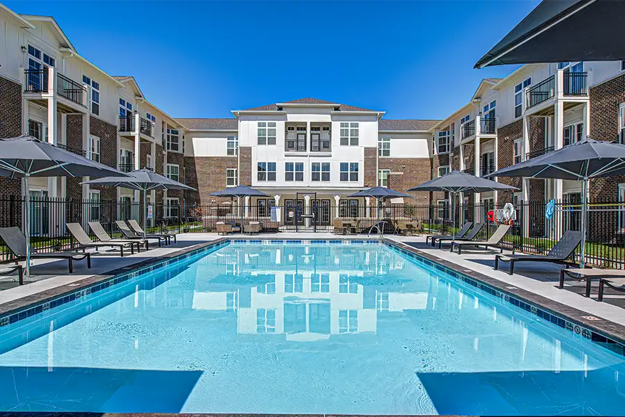 Not sure what a community means by amenities? This pool at The Edge Apartments is one example of an amenity. Pristine pool surrounded by apartment buildings at The Edge Apartments.